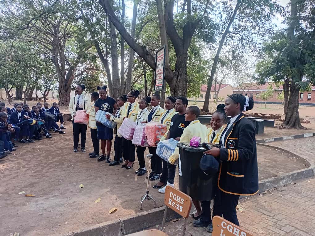 Learners at Chiredzi Gvt High receiving sanitary wear donations